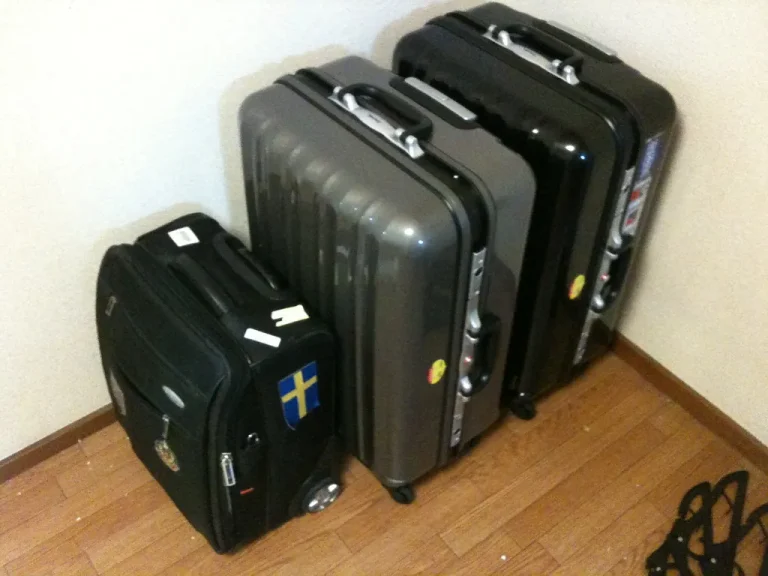 Open suitcase with packed clothes